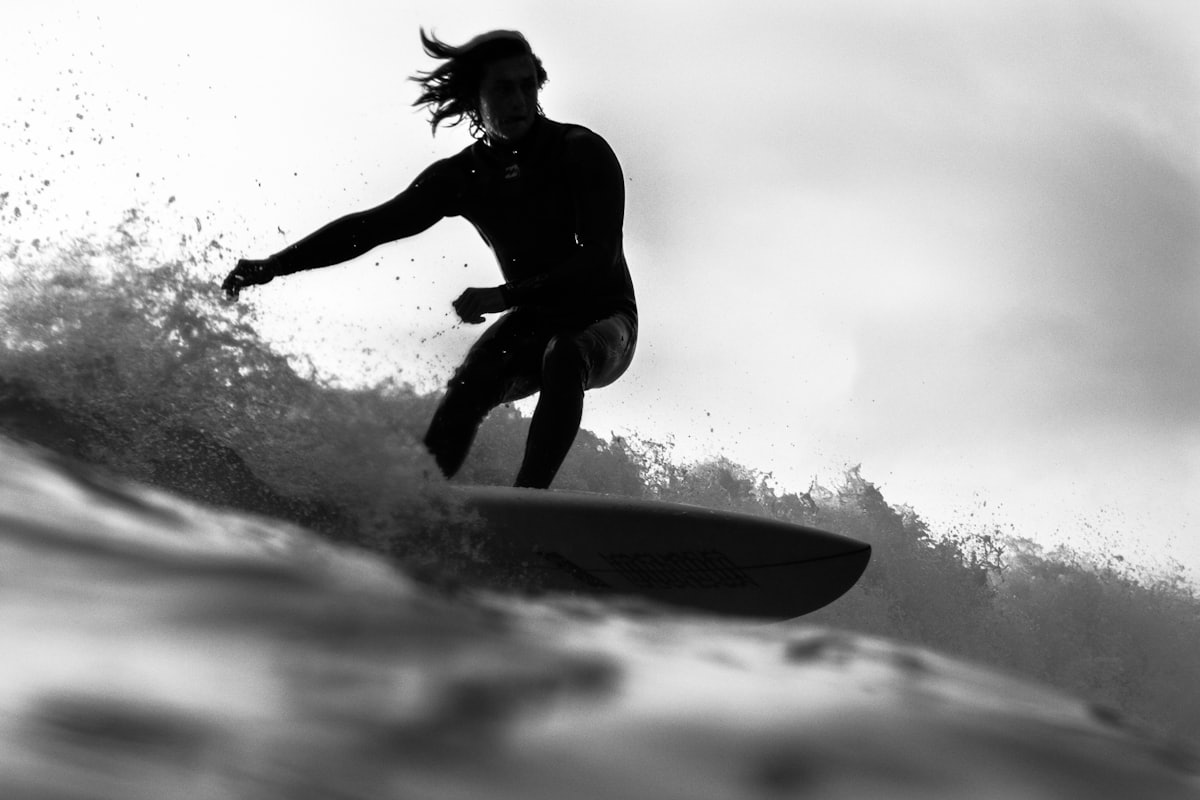 Surfer in a wetsuit, black and white